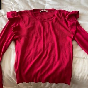 Pink Zara knit sweater with shoulder ruffle.